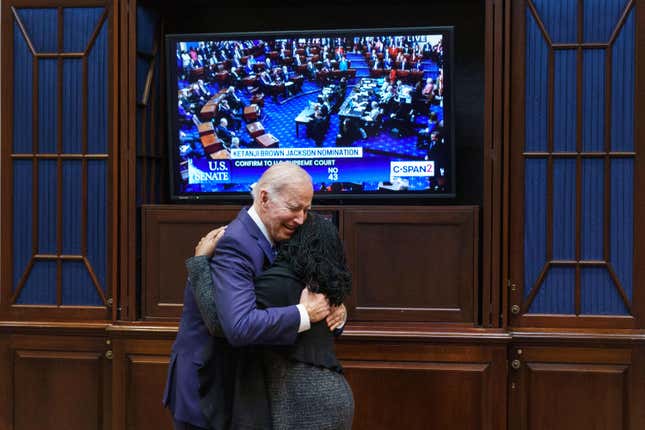 President Joe Biden embraces Judge Ketanji Brown Jackson as they watch the Senate vote on her nomination to be an associate justice on the US Supreme Court, from the Roosevelt Room of the White House in Washington, DC on April 7, 2022.