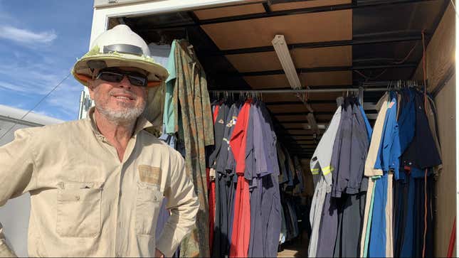 John Cantu, setting up shop selling fire-resistant clothes near Pecos, Texas.