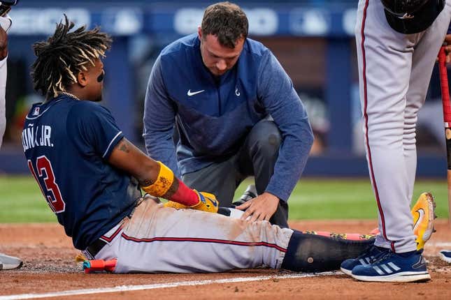 May 4, 2023; Miami, Florida, USA; Atlanta Braves right fielder Ronald Acuna Jr. (13) reacts after being struck by the ball against the Miami Marlins during the sixth inning at loanDepot Park.