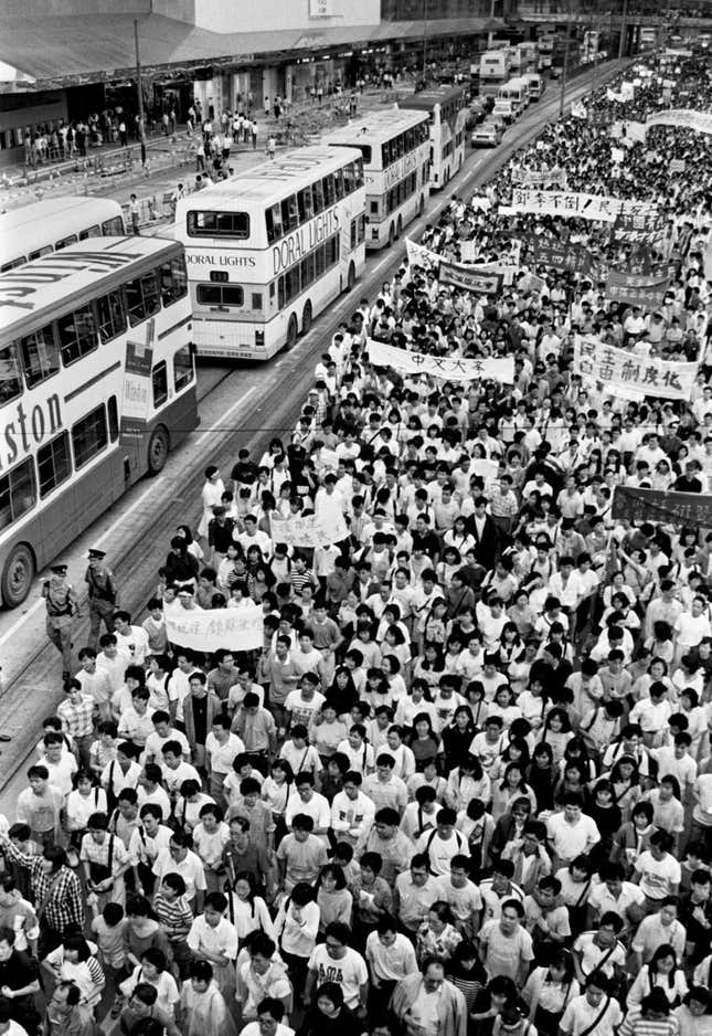 Protesters march through the central financial district of Hong Kong during a demonstration on May 21, 1989 attended by over a million residents supporting the pro-democracy demonstrations in Beijing, May 21, 1989.