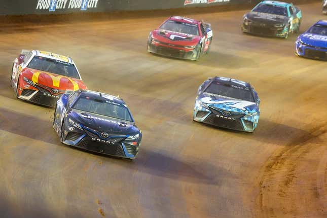 Apr 9, 2023; Bristol, Tennessee, USA; NASCAR Cup Series driver Tyler Reddick (45) leads a pack of cars at the Bristol Motor Speedway Dirt Course.