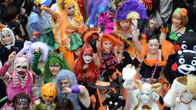 People pose for the camera at a Japanese Halloween parade.