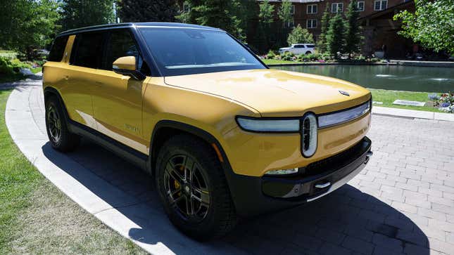 Photo of a yellow Rivian R1S SUV.