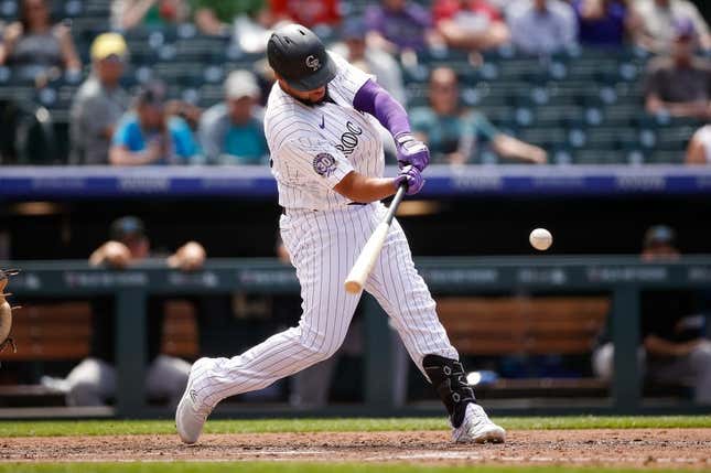 May 25, 2023; Denver, Colorado, USA; Colorado Rockies designated hitter Elias Diaz (35) hits a solo home run in the sixth inning against the Miami Marlins at Coors Field.