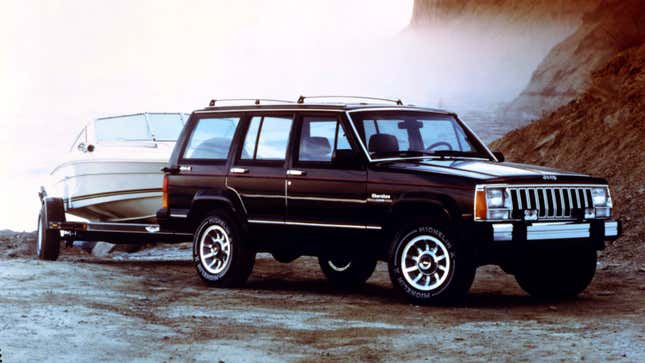 A 1986 Jeep Cherokee towing a boat