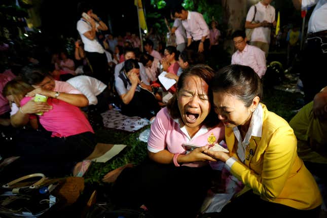 People weep after an announcement that Thailand’s King Bhumibol Adulyadej has died, at the Siriraj hospital in Bangkok, Thailand, Oct. 13. (Reuters/Chaiwat Subprasom)