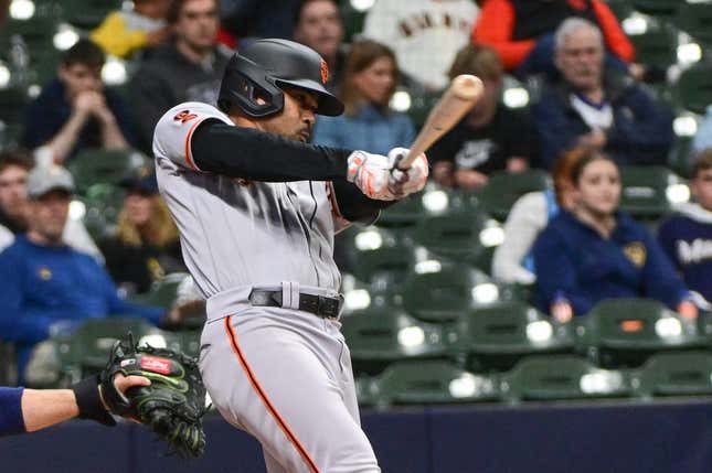 May 25, 2023;  Milwaukee, Wisconsin, USA;  San Francisco Giants first baseman LaMonte Wade Jr. (31) hits an RBI single in the fifth inning against the Milwaukee Brewers at American Family Field.