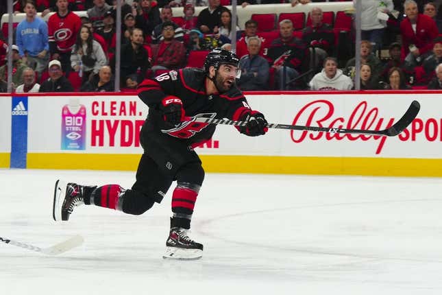 Mar 28, 2023; Raleigh, North Carolina, USA;  Carolina Hurricanes left wing Jordan Martinook (48) takes a shot against the Tampa Bay Lightning during the first period at PNC Arena.