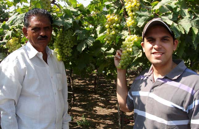 Sagar Bhansali (right) with a farmer who uses the product Biosat