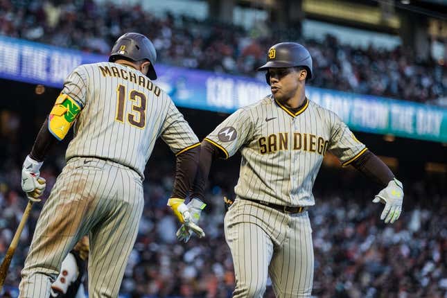 Jun 19, 2023; San Francisco, California, USA; San Diego Padres left fielder Juan Soto (22) is congratulated by third baseman Manny Machado (13) after he hit his second home run of the night against the San Francisco Giants during the fifth inning at Oracle Park.