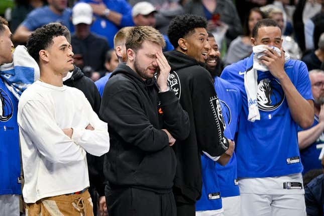 Apr 7, 2023; Dallas, Texas, USA; Dallas Mavericks guard Josh Green (8) and guard Luka Doncic (77) and forward Christian Wood (35) and forward Markieff Morris (13) and center JaVale McGee (00) watch the game between the Dallas Mavericks and the Chicago Bulls during the second half at the American Airlines Center.