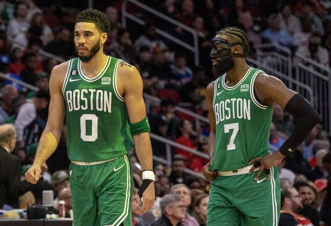 Mar 13, 2023; Houston, Texas, USA;  Boston Celtics forward Jayson Tatum (0) and  guard Jaylen Brown (7) talk to each other during a Houston Rockets timeout in the second quarter at Toyota Center.