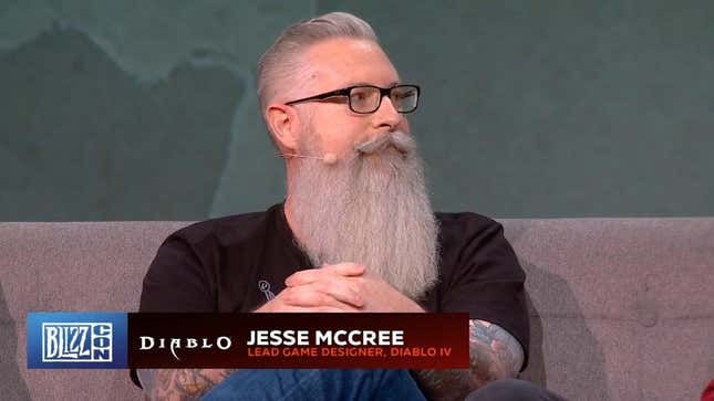 Former Blizzard developer Jesse McCree sitting during a BlizzCon 2019 panel.
