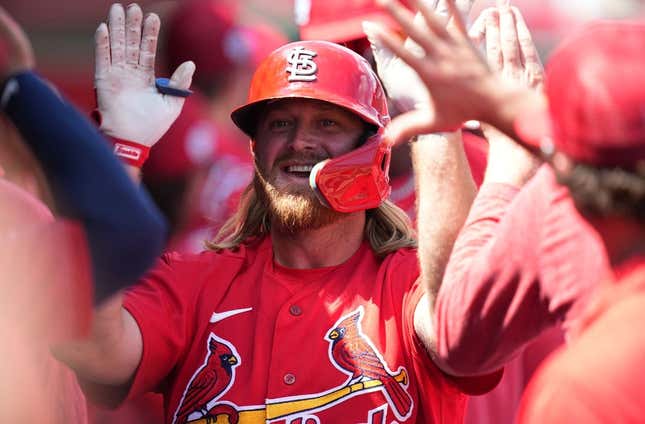 Mar 18, 2023; Jupiter, Florida, USA;  St. Louis Cardinals third baseman Taylor Motter (55) is congratulated by teammates after hitting a home run in the second inning against the Detroit Tigers at Roger Dean Stadium.