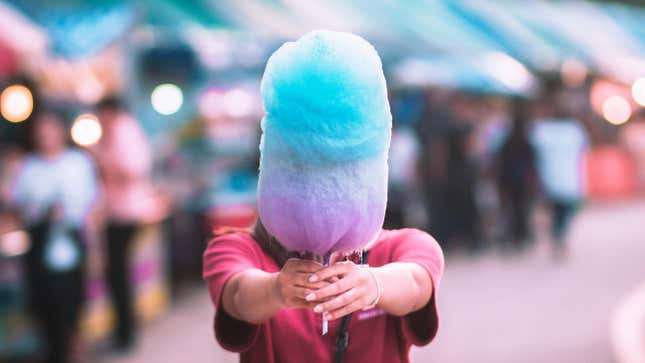 person holding cotton candy