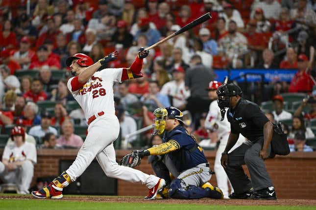 May 15, 2023; St. Louis, Missouri, USA; St. Louis Cardinals third baseman Nolan Arenado (28) hits a one run sacrifice fly against the Milwaukee Brewers during the sixth inning at Busch Stadium.