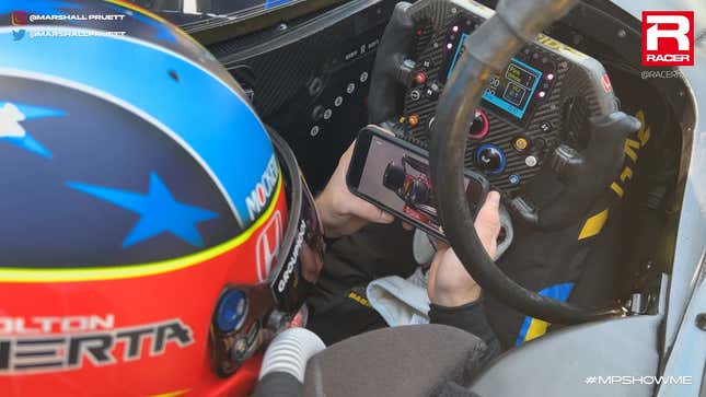 Colton Herta watching F1 practice highlights inside his IndyCar cockpit