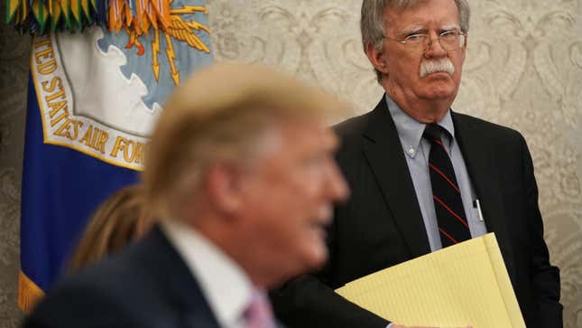 National Security Adviser John Bolton listens to U.S. President Donald Trump speak during a meeting with Egyptian President Abdel-Fattah el-Sisi in the Oval Office of the White House April 9, 2019 in Washington, DC.