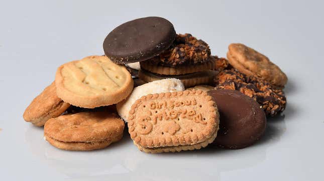 assortment of girl scout cookies on white background