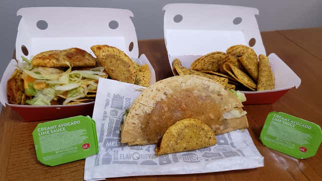 Our complete Jack In The Box order, with the Tiny Taco spooning the regular taco for scale.