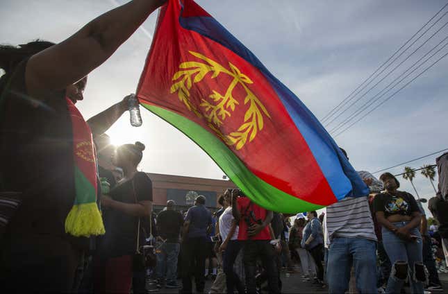 Nipsey Hussle fans wave Eritrean flag during vigil for him in Los Angeles April 1, 2019.