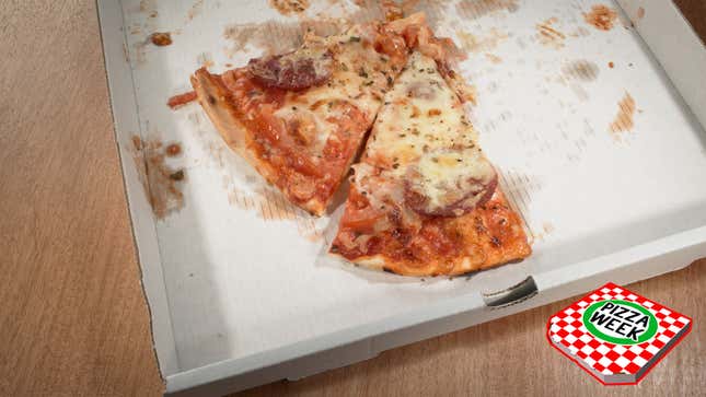 Two slices of pizza left in delivery box