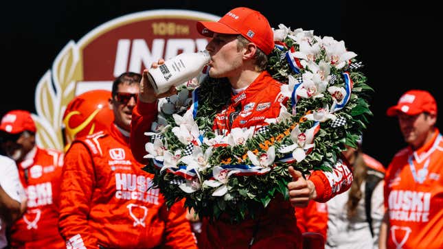 Chip Ganassi Racing driver Marcus Ericsson sips milk after winning the 2022 Indy 500