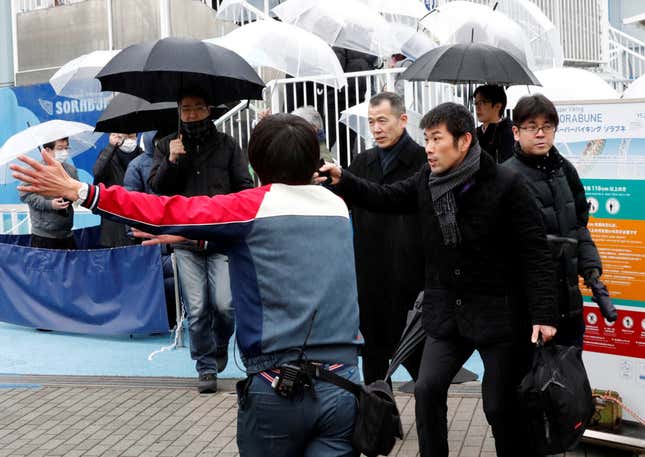 An official directs participants during an anti-missile evacuation drill at the Tokyo Dome City amusement park in Tokyo, Japan on Jan. 22.