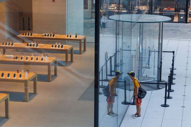 A man looks into a huge empty store.