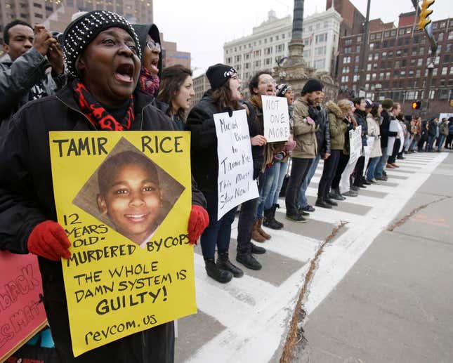 In this Nov. 25, 2014, file photo, demonstrators block Public Square in Cleveland, during a protest over the police shooting of Tamir Rice. The city of Cleveland has reached a settlement Monday, April 25, 2016, in a lawsuit over the death of Rice, a black boy shot by a white police officer while playing with a pellet gun.