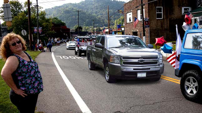 Image for article titled Unadorned Chevy Silverado Driven By Town Comptroller Somehow Makes Cut as Parade Float