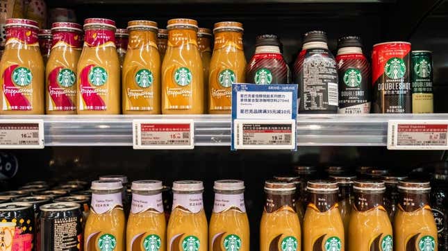 Rows of Starbucks bottled frappucinos on grocery stores helves