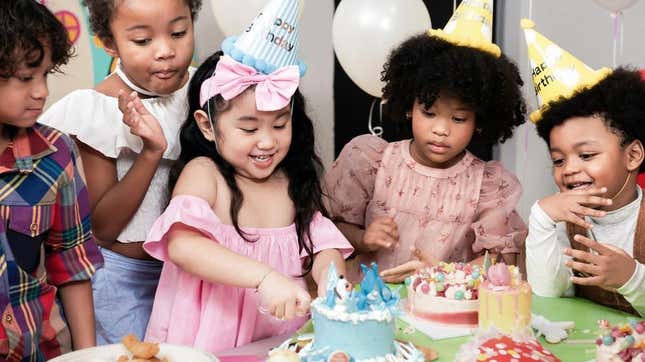 Kids eating cake at birthday party
