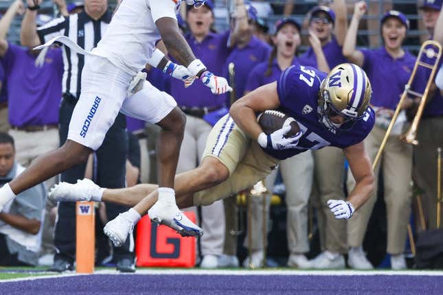 Sep 2, 2023; Seattle, Washington, USA; Washington Huskies tight end Jack Westover (37) dives into the end zone for a touchdown against the Boise State Broncos during the second quarter at Alaska Airlines Field at Husky Stadium.