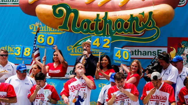 Contestants compete in the annual Nathan’s Hot Dog Eating Contest on July 4, 2018 in NYC.