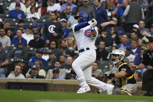 Jun 14, 2023; Chicago, Illinois, USA; Chicago Cubs right fielder Seiya Suzuki (27) singles during the first inning against the Pittsburgh Pirates at Wrigley Field.