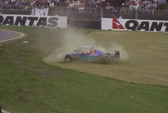 Johnny Herbert of Great Britain and Jacques Villeneuve of Canada spin off the track after a collision on the first corner during the 1997 Australian Grand Prix.