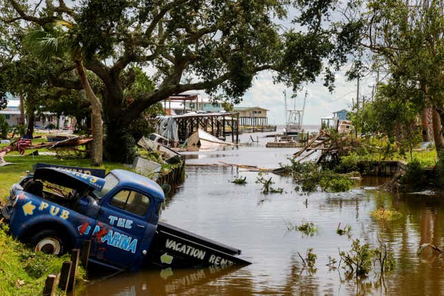 A view of a vehicle partially submerged in a canal after the arrival of Hurricane Idalia in Horseshoe Beach, Florida, U.S., August 30, 2023. 