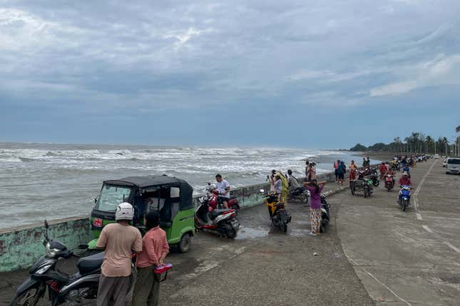 People look over the Bay of Bengal in Sittwe, Rakhine, Myanmar before Mocha made landfall on May 13. 
