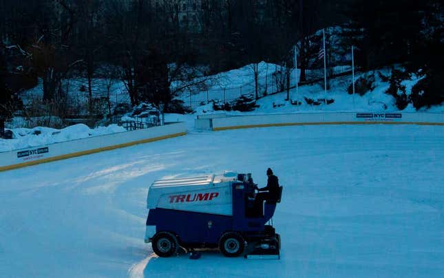 A worker drives a Zamboni ice resurfacer painted with the Trump logo on the Wollman ice skating rink after its closure in Central Park, New York on February 21, 2021.