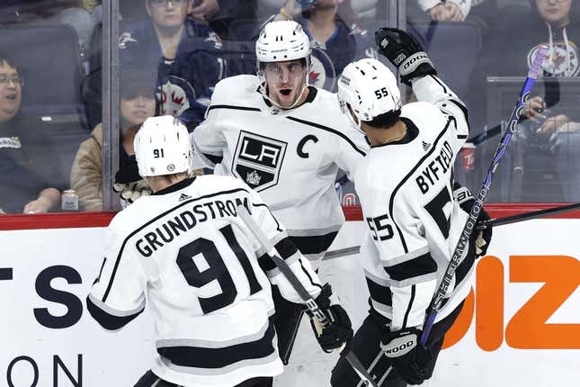 Feb 28, 2023; Winnipeg, Manitoba, CAN; Los Angeles Kings center Anze Kopitar (11) celebrates his fourth goal of the game in the third period against the Winnipeg Jets at Canada Life Centre.