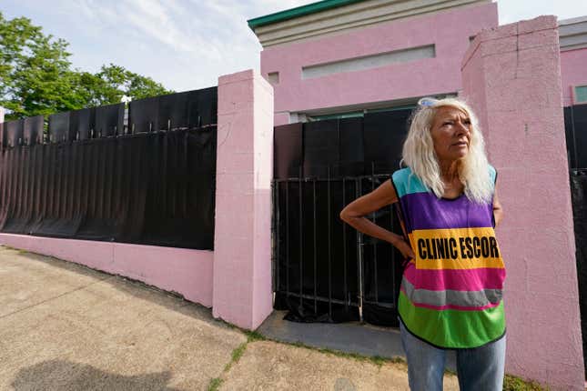 Derenda Hancock, co-organizer of the "Pinkhouse Defenders," a group of volunteers that shield and escort patients entering the Jackson Women's Health Organization (JWHO), Mississippi's last remaining abortion clinic, called the "Pinkhouse," stands watch on May 3, 2022.