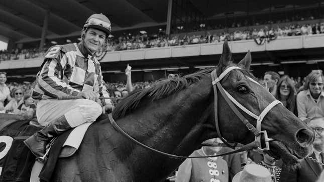 Jockey Ron Turcotte walks Secretariat towards the winner’s circle after they captured the Triple Crown by winning the Belmont Stakes before a crowd of 70,000 fans at Belmont Park in Elmont, N.Y., June 9, 1973.