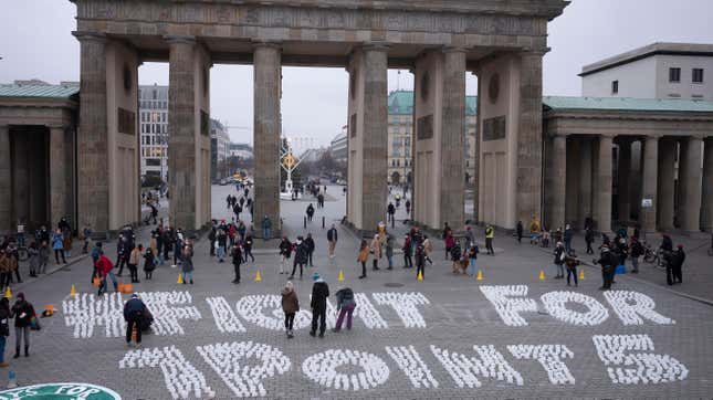 Students set up candles for the slogan “Fight for one point five” during a protest of the Fridays For Future movement at the Brandenburg Gate in Berlin.
