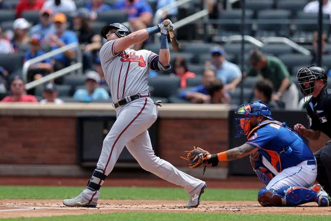 Aug 12, 2023; New York City, New York, USA; Atlanta Braves third baseman Austin Riley (27) follows through on an RBI single against the New York Mets during the first inning at Citi Field.