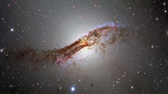 The galaxy Centaurus A, shrouded in bands of dust.