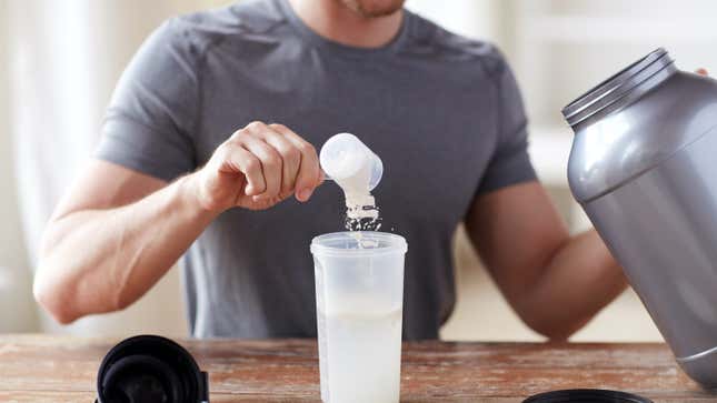 man mixing a protein shake