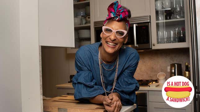 Chef Carla Hall smiling in a kitchen