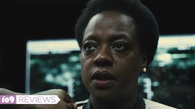 Amanda Waller stares at an out-of-frame Bloodsport, who's threatening to kill her with a pen.