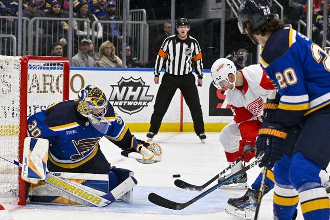 Mar 21, 2023; St. Louis, Missouri, USA;  Detroit Red Wings right wing Alex Chiasson (48) scores against St. Louis Blues goaltender Joel Hofer (30) during the first period at Enterprise Center.